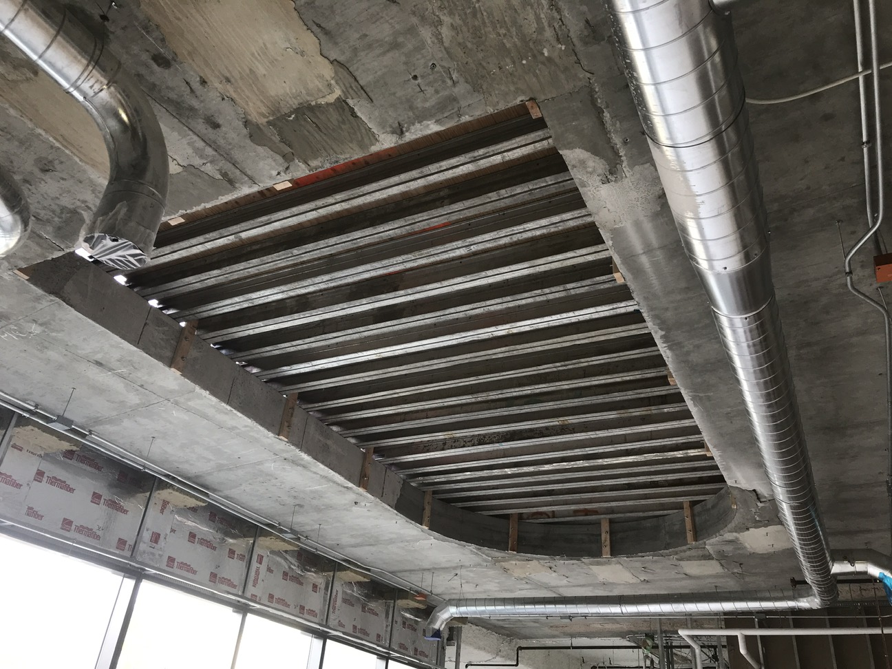 Elevator shaft retrofit tendon relocation