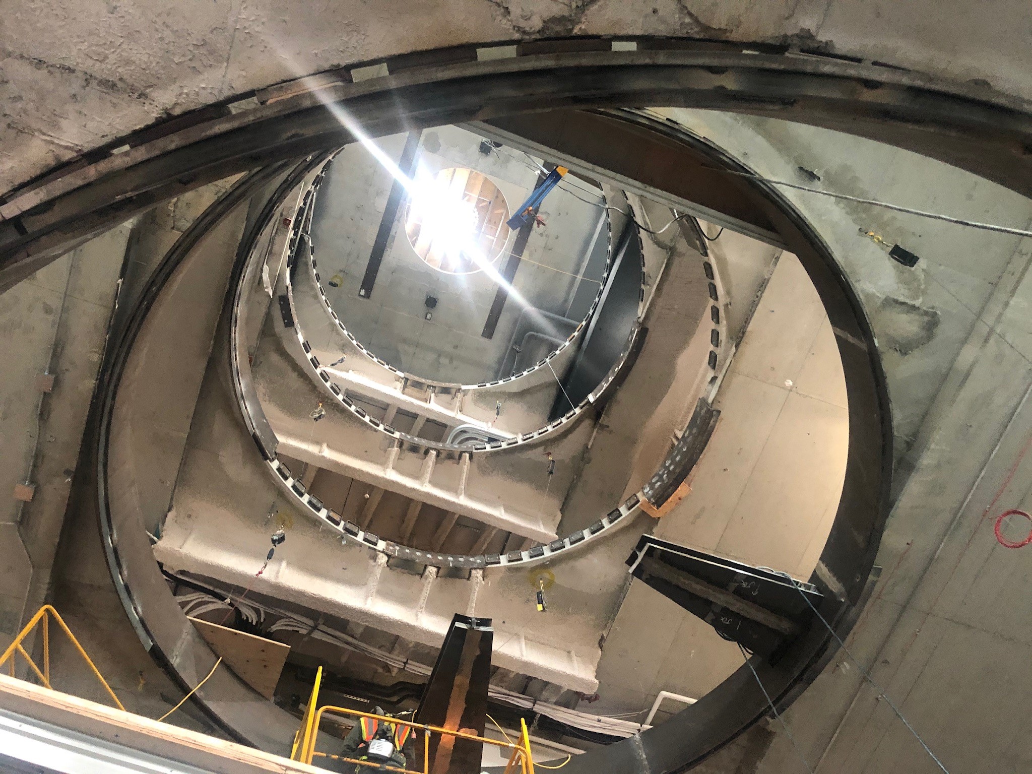 Elevator shaft retrofit tendon relocation