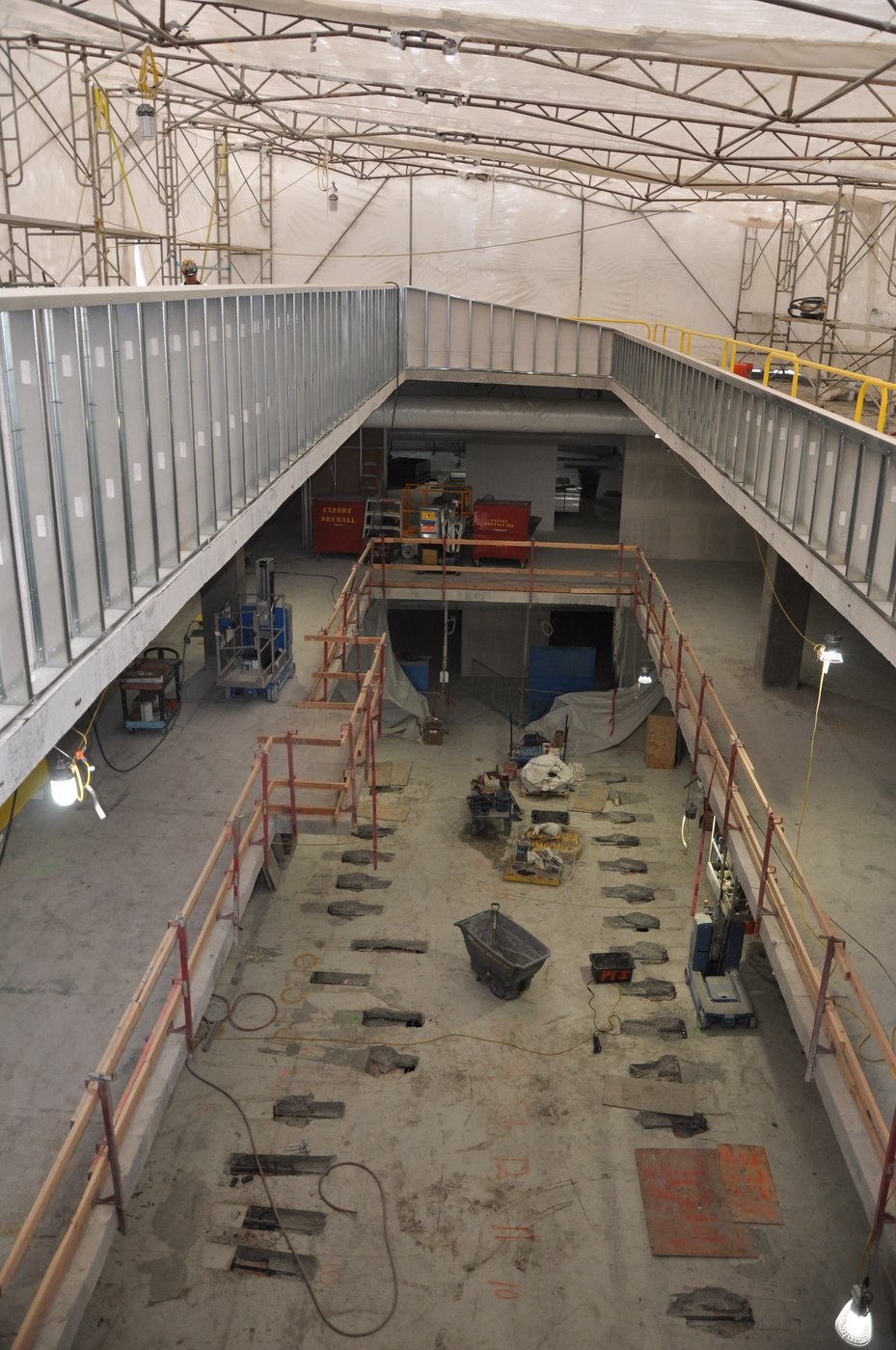 Every rectangular opening is a PT anchor pocket worked by the crew. More than 1,200 across multiple floors, with no shoring and no other trade stopping.